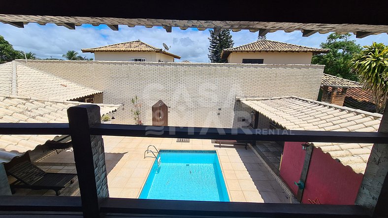 Casa em condomínio com piscina privativa, à 50 metros da pra